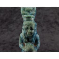 Egyptian faience amulet of Isis with Horus in her lap